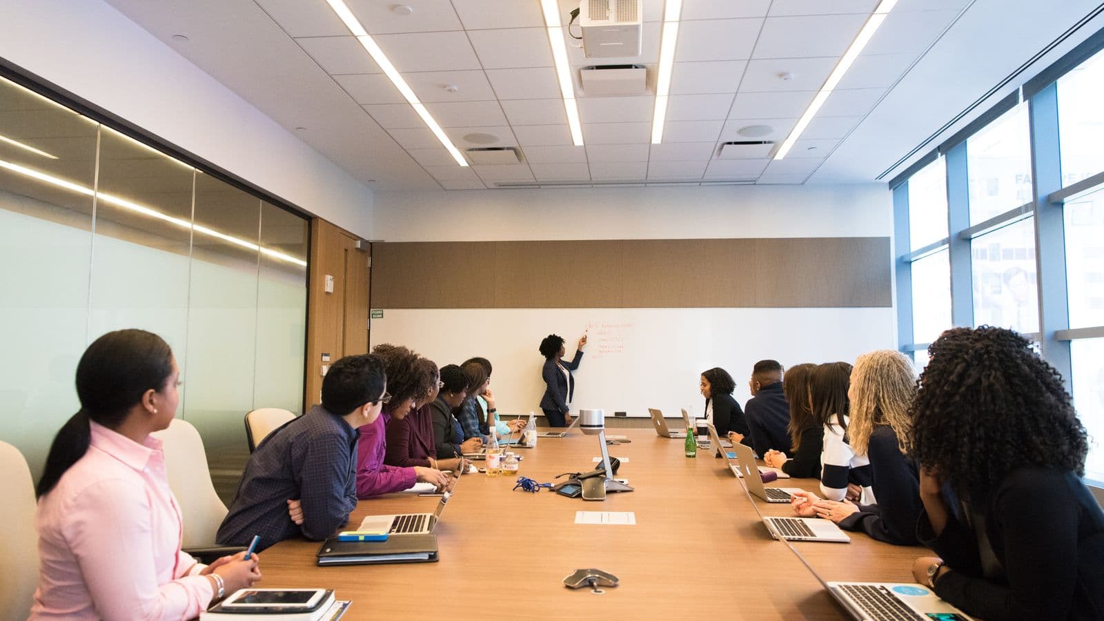 Salary Guides consultants reviewing work together, from the Henley Morgan article NetSuite Consultant Salary Guide 2026 (UK & US)