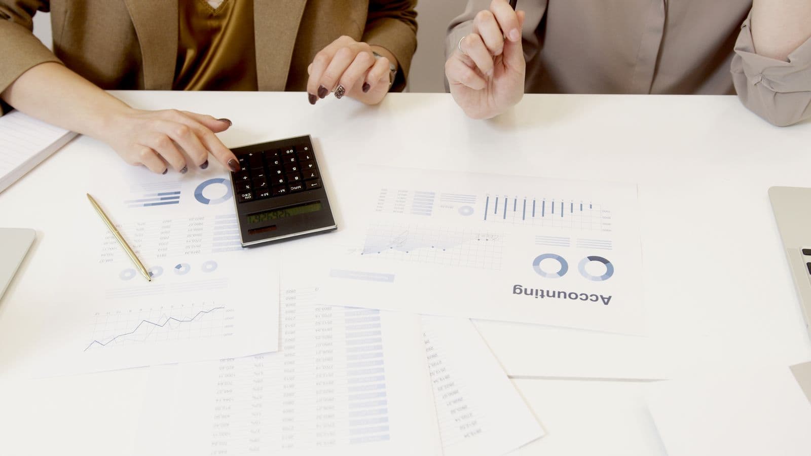 Salary Guides consultants reviewing work together, from the Henley Morgan article Sage Intacct Salary Guide 2026 (UK & US)