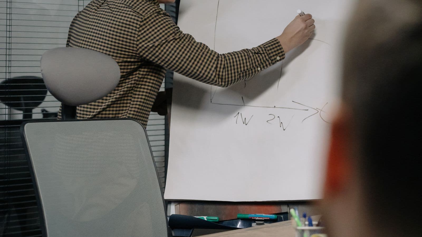 Epicor professionals in a workplace meeting, illustrating Epicor Kinetic Jobs UK: The Smart Client Retirement Effect