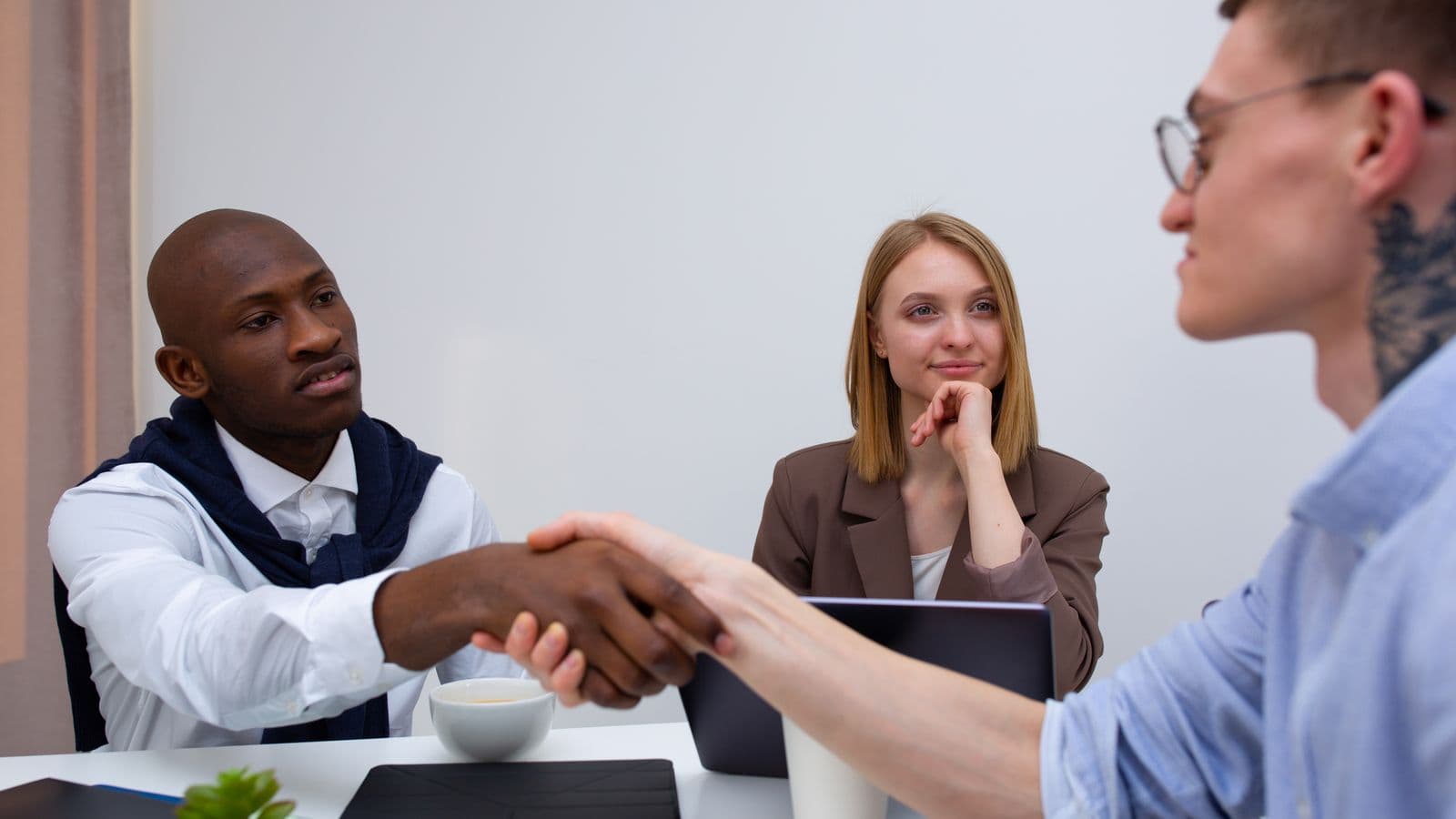 Odoo consultants reviewing work together, from the Henley Morgan article Odoo Jobs UK: Why the 7% Growth Slowdown Matters for 2026