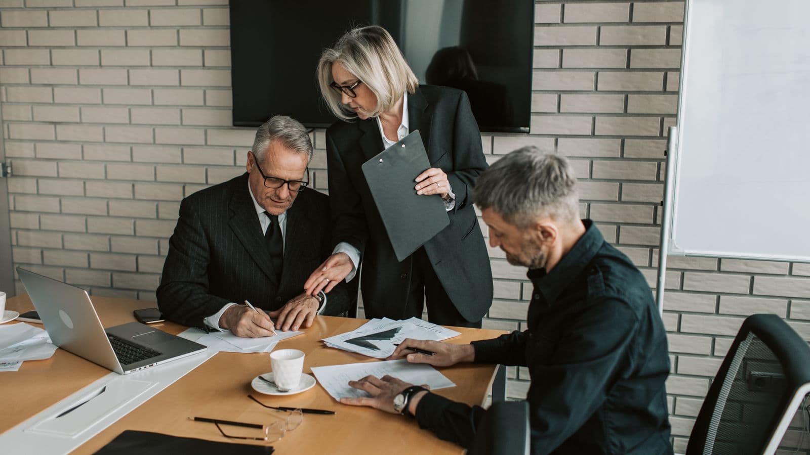 SAP S/4HANA consultants reviewing work together, from the Henley Morgan article SAP S/4HANA Jobs UK: What Happened When Compatibility Packs Expired