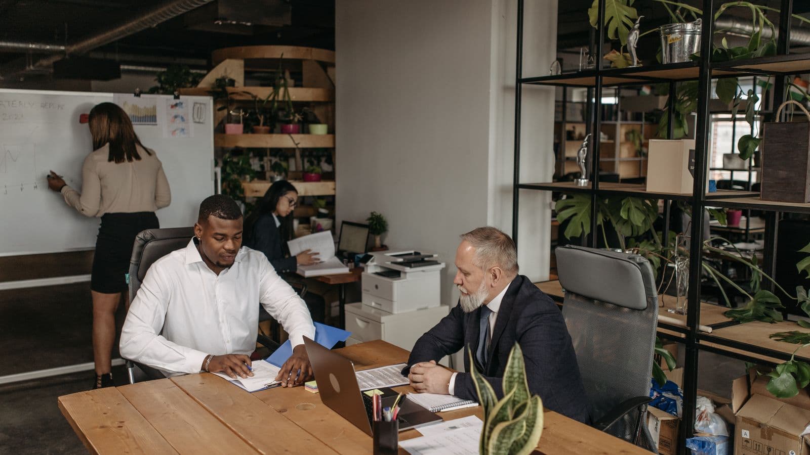 NetSuite consultants reviewing work together, from the Henley Morgan article NetSuite Skills UK: The 2026.2 Shift No One Saw Coming