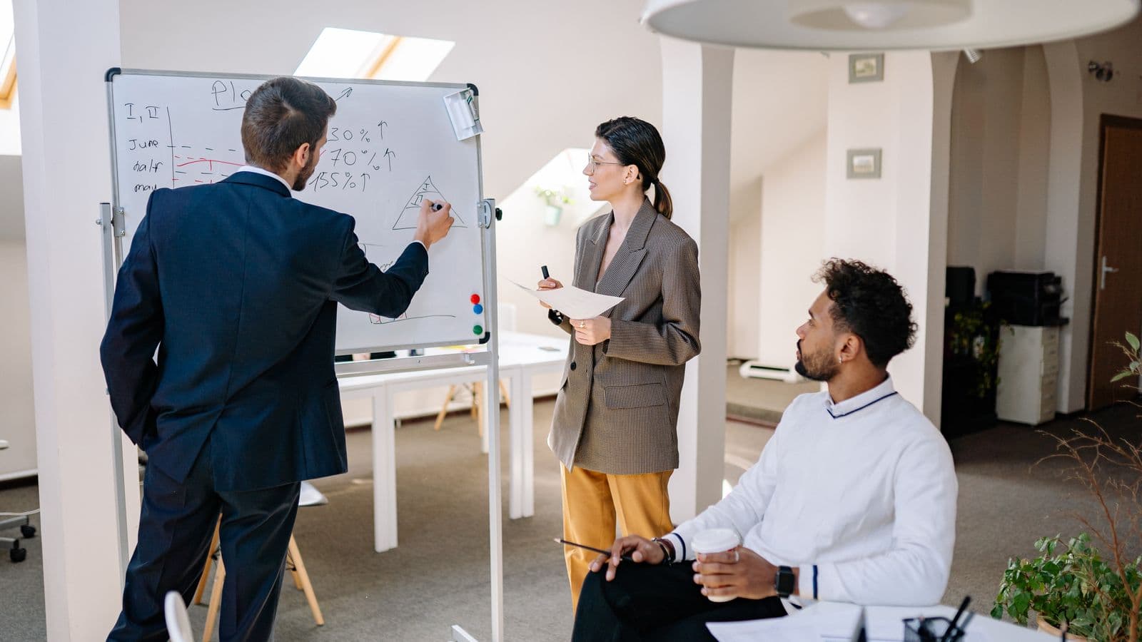 Dynamics 365 Business Central professionals in a workplace meeting, illustrating Business Central Integration Jobs UK: The SOAP Deadline