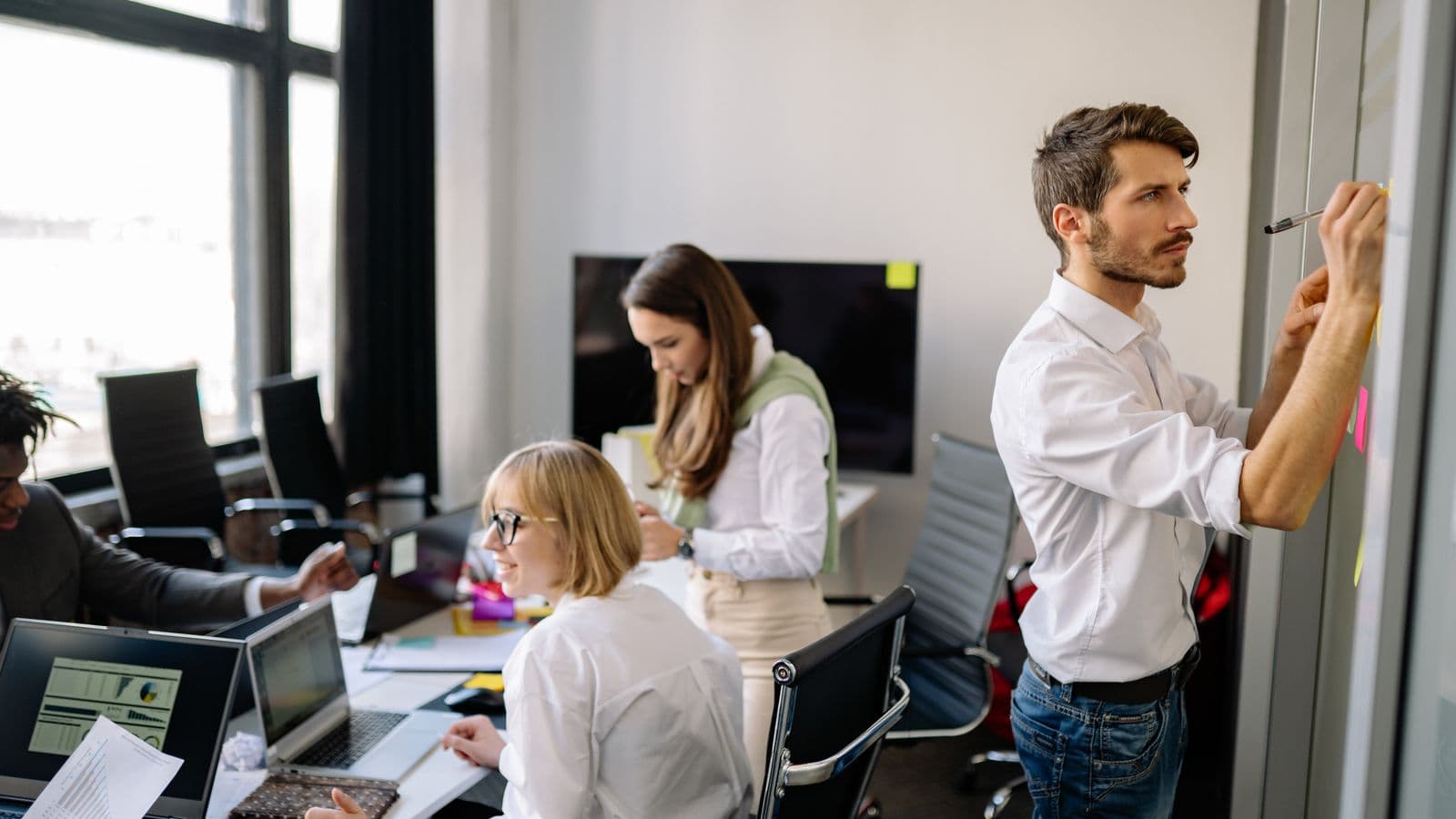 Epicor consultants reviewing work together, from the Henley Morgan article Epicor Cloud Migration Jobs: The US Hiring Wave Begins