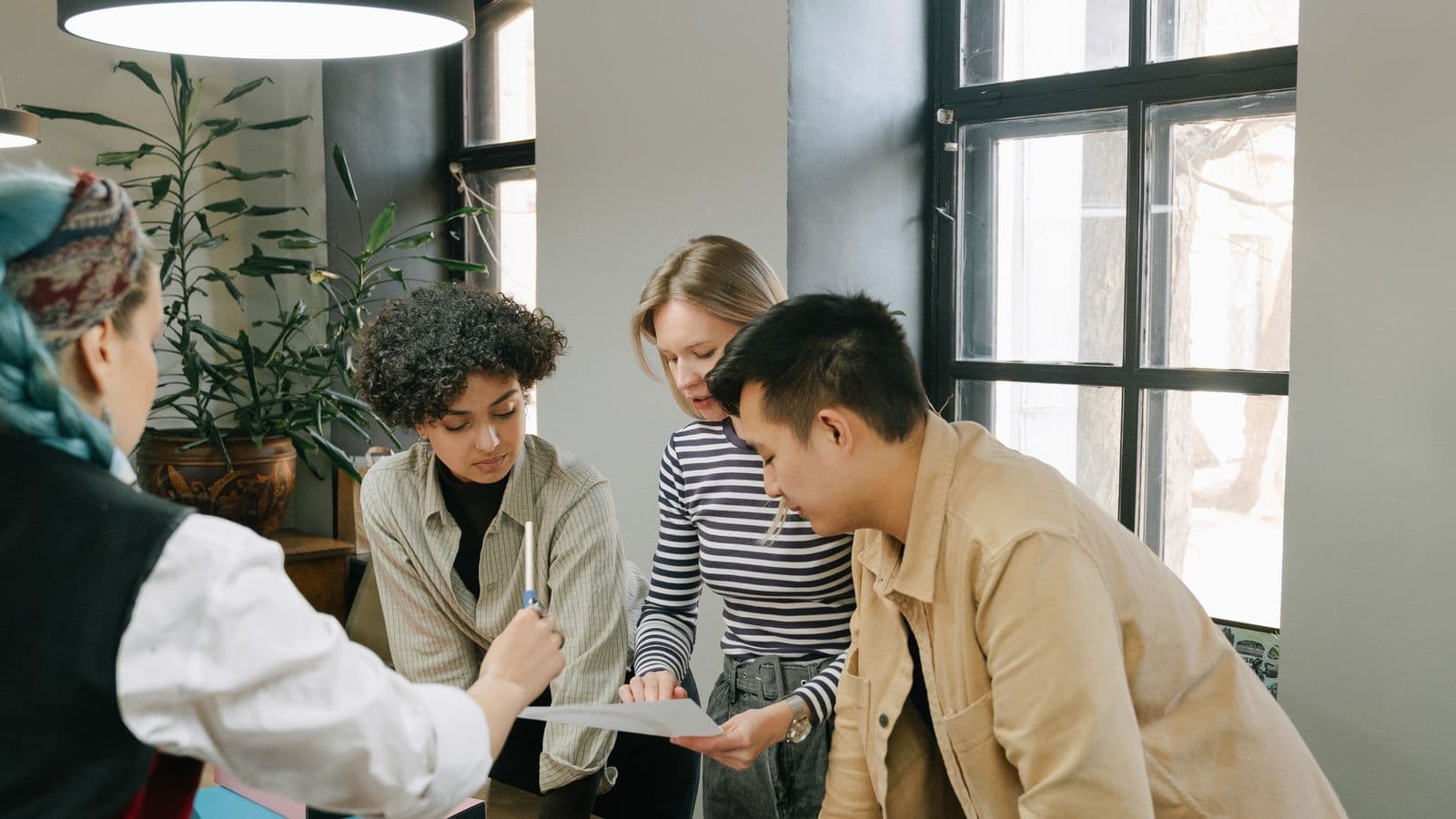 Dynamics 365 Business Central consultants reviewing work together, from the Henley Morgan article Business Central Agent Jobs USA: The 2026 Hiring Shift