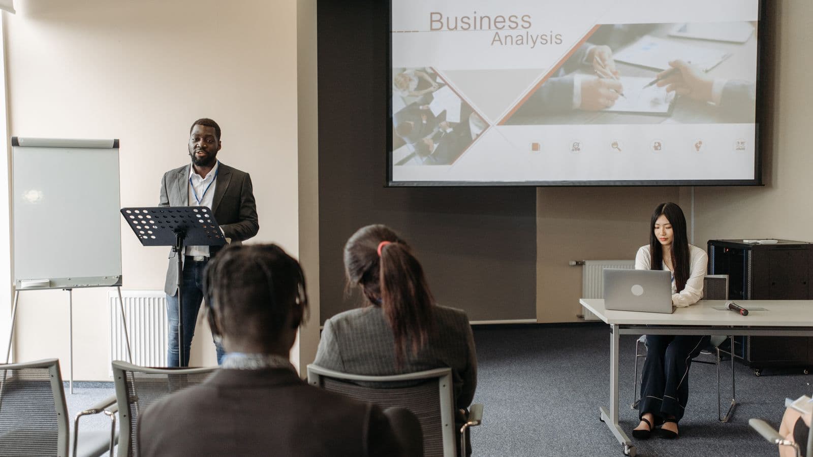Insights consultants reviewing work together, from the Henley Morgan article Why NetSuite ERP for Growth Is Essential for Scaling Businesses in 2026