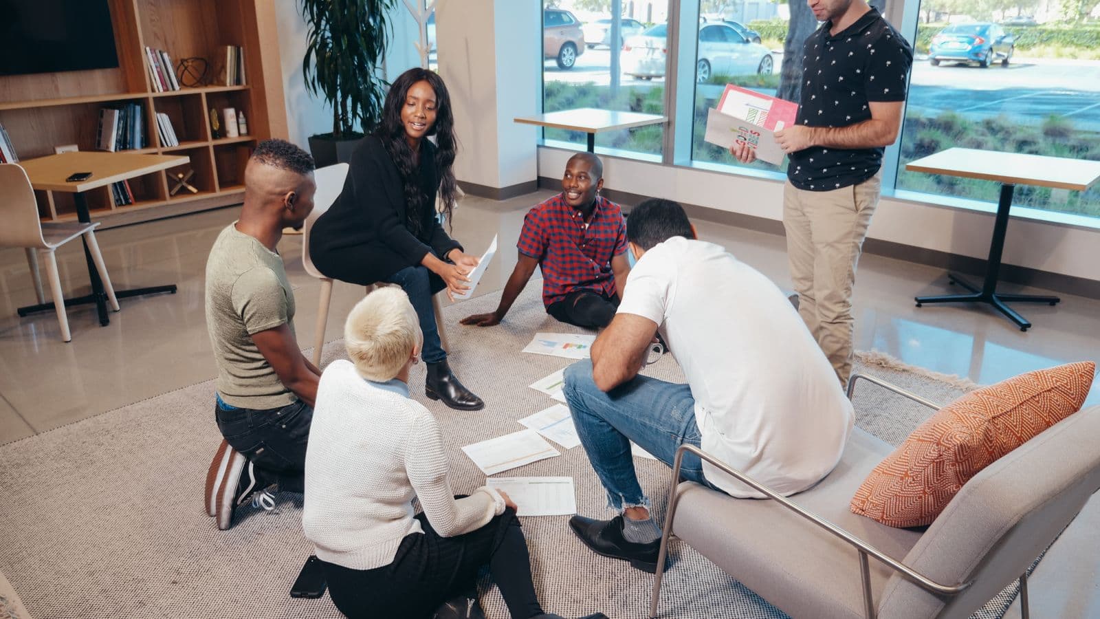 Insights professionals in a workplace meeting, illustrating ERP Contract Recruitment: Finding Short-Term Talent Fast
