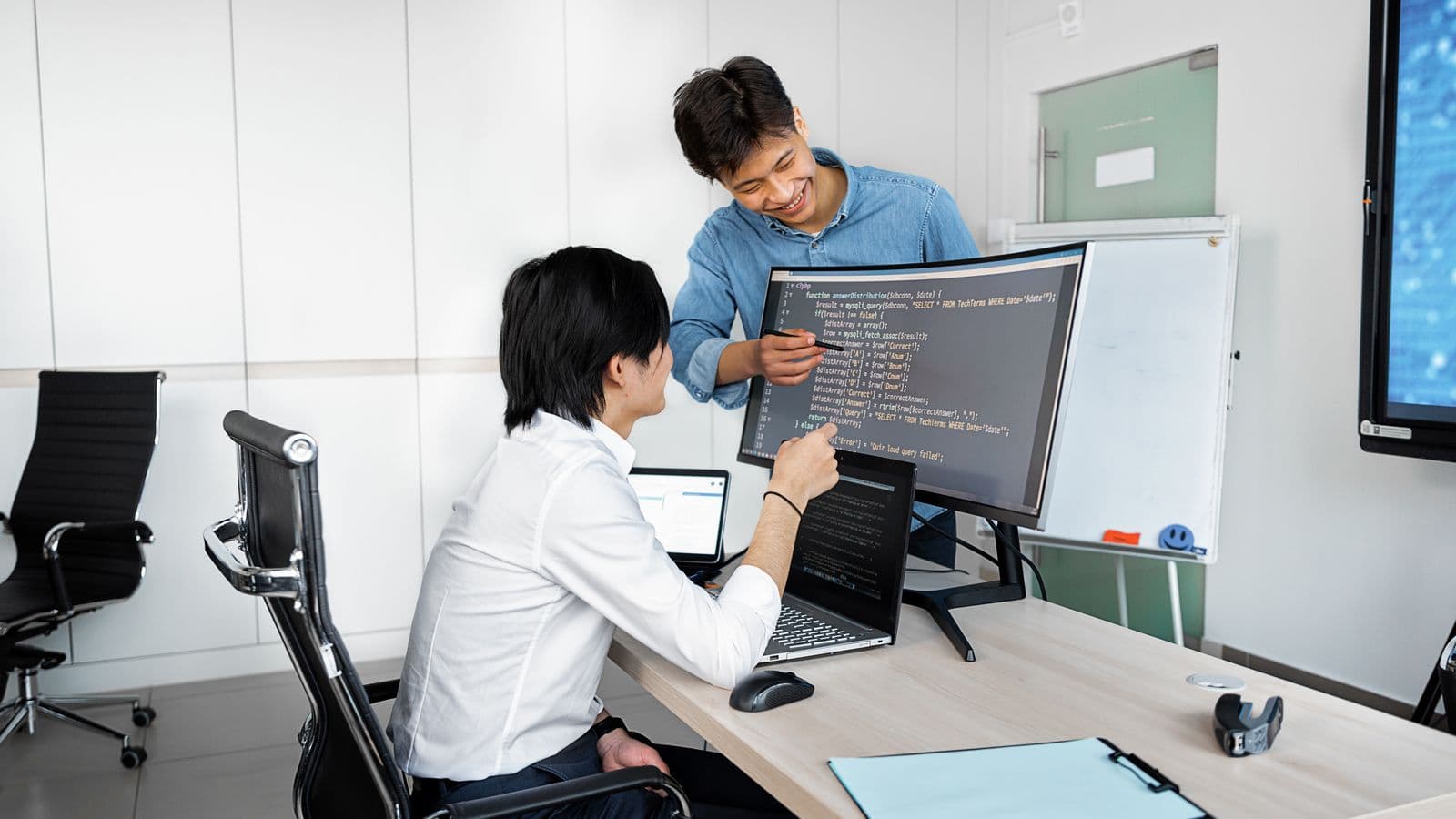 Hiring Guides professionals in a workplace meeting, illustrating NetSuite Partner Hiring vs End User Hiring: The Key Differences