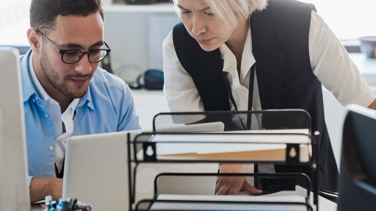 Salary Guides professionals in a workplace meeting, illustrating Sage Intacct Salary Guide 2026 (UK & US)
