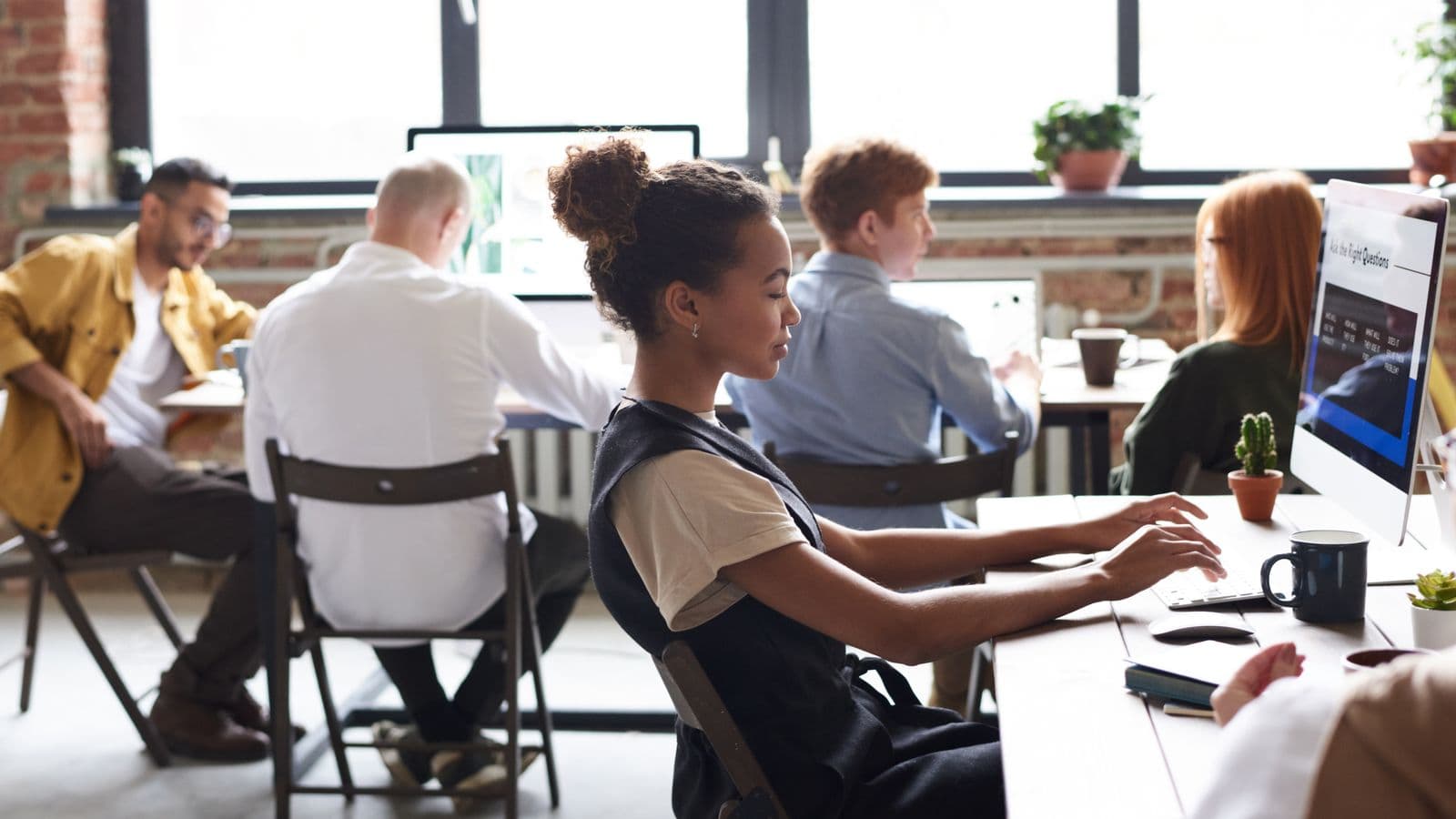 Insights professionals in a workplace meeting, illustrating SAP Business One 2025: What Businesses Should Expect