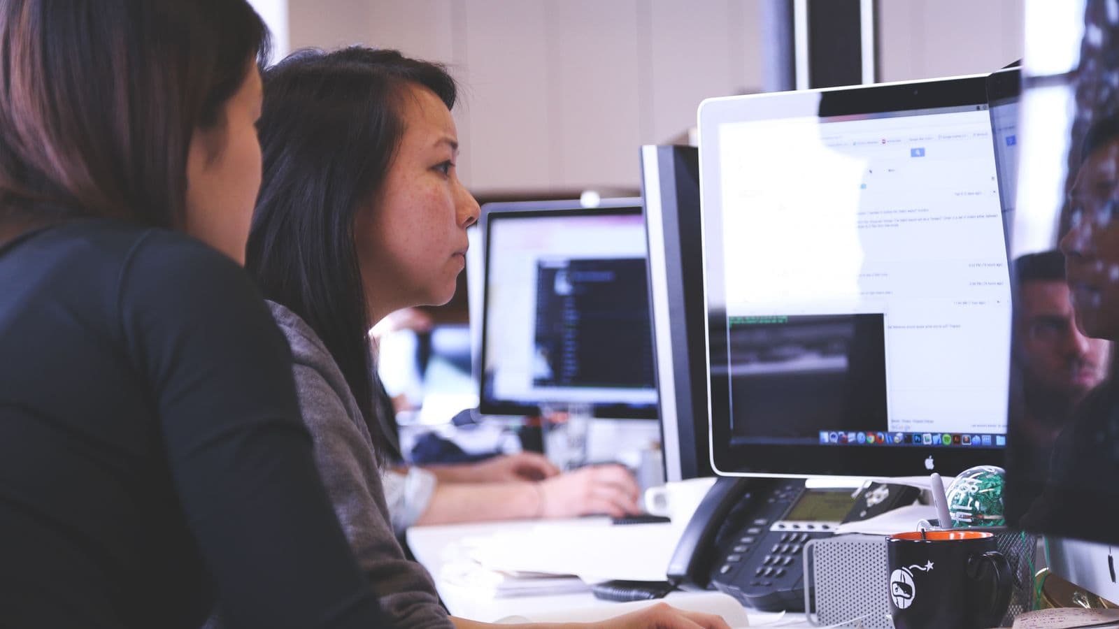 Insights professionals in a workplace meeting, illustrating Women in ERP: Driving Change in Technology Careers
